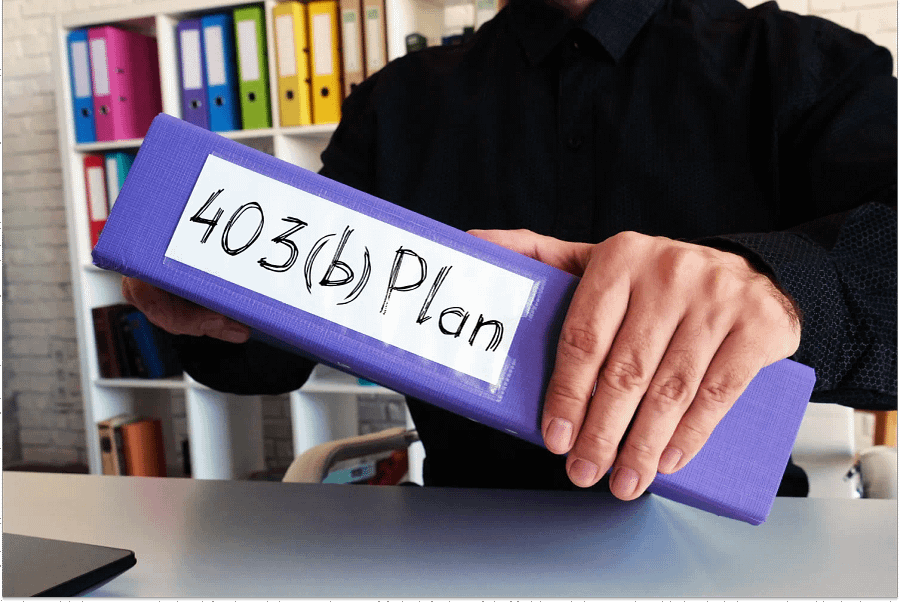 A man holding a concept files and notes about 403(b).