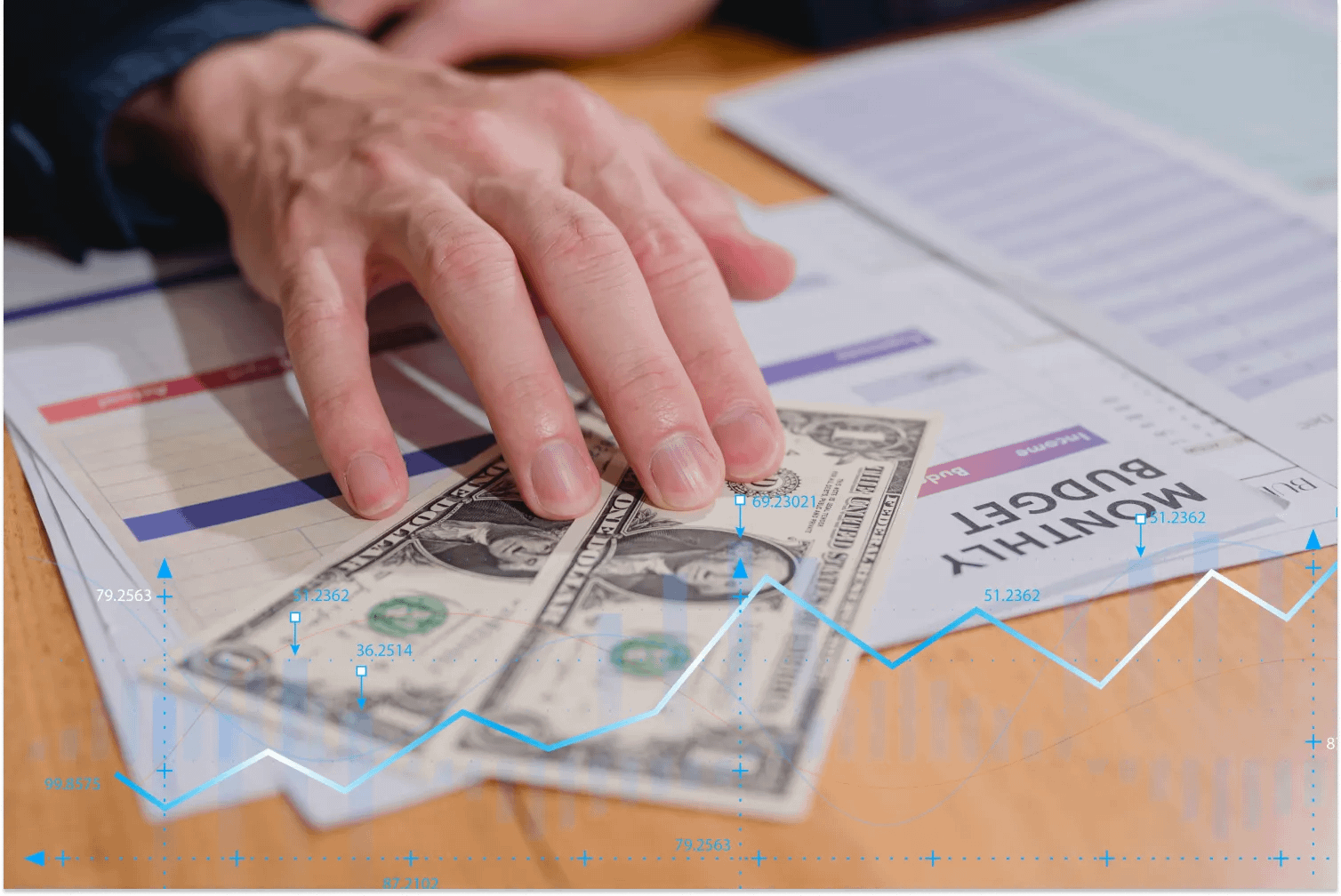A hand showing dollar note with monthly budget planning, budget allocation for expenses and a budget for future retirement.